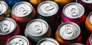 Cans of soda from a top down view.