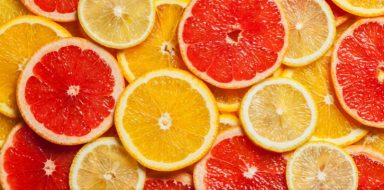 An assortment of citrus fruit slices including oranges, lemons and grapefruits.